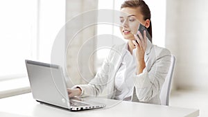 Attractive office worker taking phone call