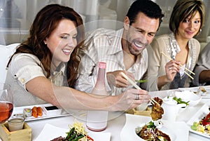 attractive people eating and socializing