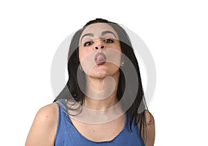 Attractive and playful woman sticking out tongue in funny fresh face expression mocking