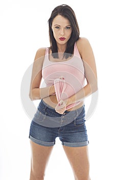 Attractive Playful Young Caucasian Woman Pulling Seductively At Her Pink Vest Top