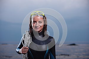 Attractive portrait of cheerful young diver woman