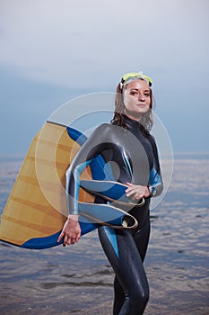 Attractive portrait of cheerful young diver woman