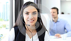 Attractive positive young businesspeople and colleagues in a call center office.