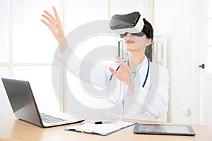 Attractive pretty doctor wearing VR technology