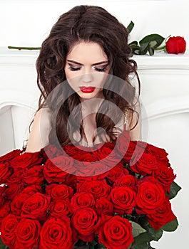 Attractive pretty woman with red roses bouquet, valentines day.