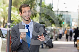 Attractive professional male news reporter wearing