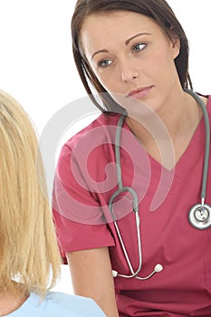 Attractive Professional Young Female Doctor Having A Conversation With A Patient