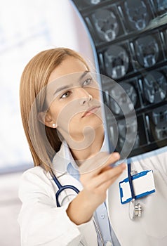 Attractive radiologist analysing x-ray image