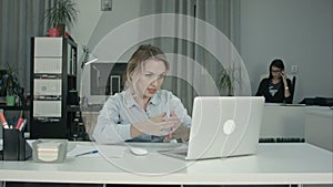 Attractive recruiter conducting job interview using laptop
