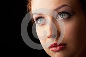 Attractive red hair girl blue eyed closeup