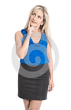 Attractive reflective middle aged woman in summer clothes looking sideways.