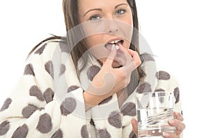 Attractive Relaxed Young Woman Feeling Poorly and Unwell Taking Medicine