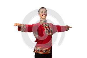 Attractive russian guy dancing in folk costume isolated on white