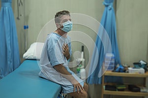 Attractive and scared man infected by covid-19 - dramatic portra