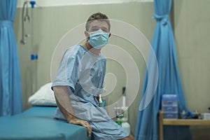 Attractive scared man infected by covid-19 - dramatic portra