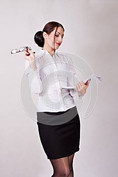 Attractive secretary holding papers