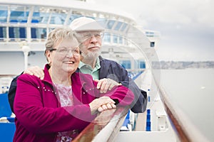 Attractive Senior Couple Enjoying The Deck of a Cruise Ship