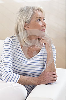 Attractive Senior woman portrait, on bright background