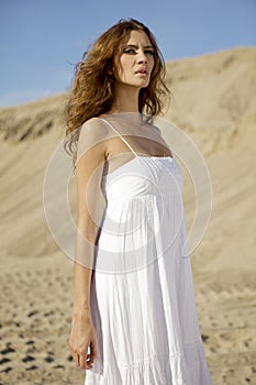 Attractive and sensuality woman dancing in the desert