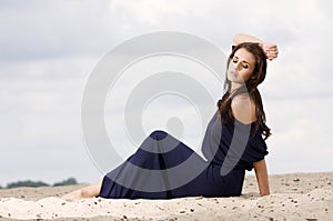 Attractive and sensuality woman dancing in the desert