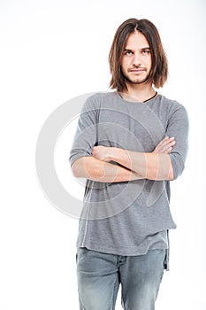 Attractive serious young man with long hair