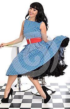 Attractive Happy Young Vintage Pin-Up Model Posing In Retro Polka Dot Dress
