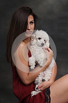 Attractive, sexy muscular brunette caucasian girl posing in studio on isolated background. Style, trends, fashion concept.