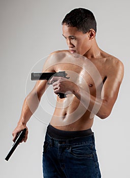 Attractive Shirtless Man With Guns