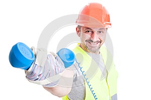 Attractive smiling builder giving a retro receiver