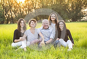 Attractive Smiling diverse family portrait outdoors