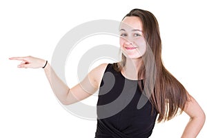 Attractive smiling girl standing and pointing finger up