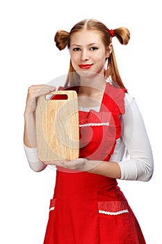 Attractive smiling housewife in red apron with funny ponytails a
