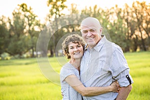 Attractive Smiling Mature couple portrait outdoors photo
