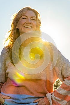 Attractive Smiling Middle Aged Woman Outside in Sunshine