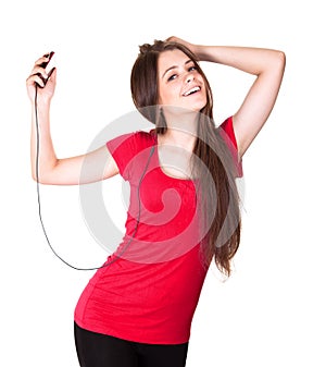 Attractive smiling teen girl listen music