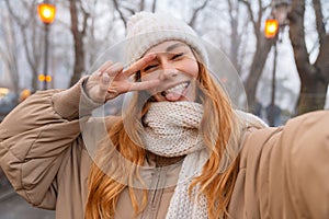 Attractive smiling young girl wearing winter clothes