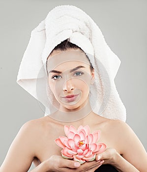 Attractive Spa Model Woman with Healthy Skin and Bath Flower