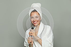 Attractive Spa woman wellness model taking a shower and singing