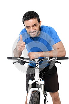 Attractive sport man riding mountain bike training giving thumb up
