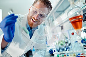 Attractive student of chemistry working in lab