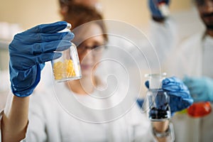 Attractive student of chemistry working in laboratory