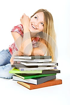 Attractive student girl with pile of books