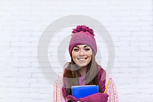 Attractive Student Smile Teenage Girl In Pink Hat Holding Folder Pencil