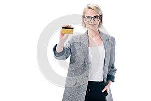 attractive stylish businesswoman showing credit card,