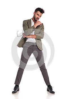 Attractive stylish man posing seductively while standing