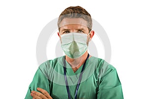 attractive and successful medicine doctor or nurse man posing confident for hospital staff corporate portrait  in green medical