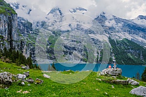 Attractive summer morning on the unique Oeschinensee Lake. Wonderful outdoor scene in the Swiss Alps with Bluemlisalp