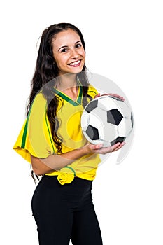 Attractive supporting woman holding football