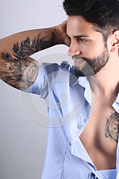 Attractive tattooed man posing