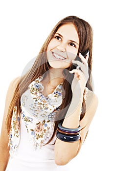 Attractive teenage girl talking on the phone